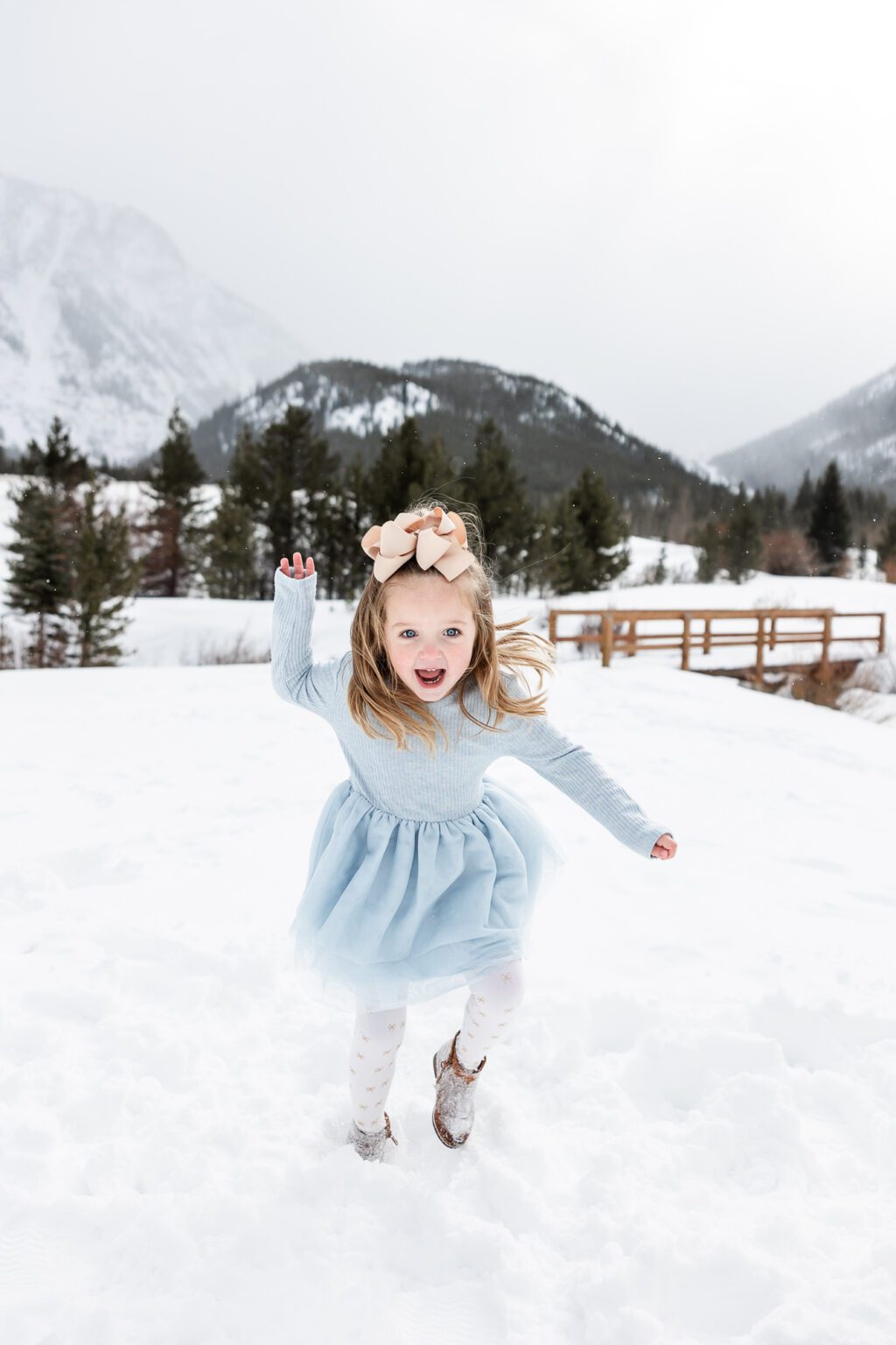 navy blue dress for baby girl Colorado Winter Elopement near Breckenridge at Sapphire Point in Dillon main image 0