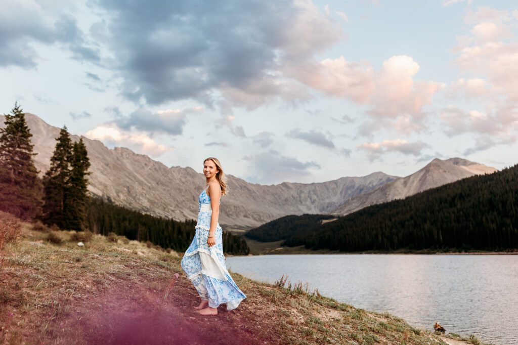 Colorado mountain senior pictures at Officer’s Gulch and Clinton Gulch Dam featuring wildflowers, alpine lakes, mountain views and a cotton candy sunset.
